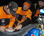 red bull/ktm riders chris blais and andy grider review their notes for the next day
